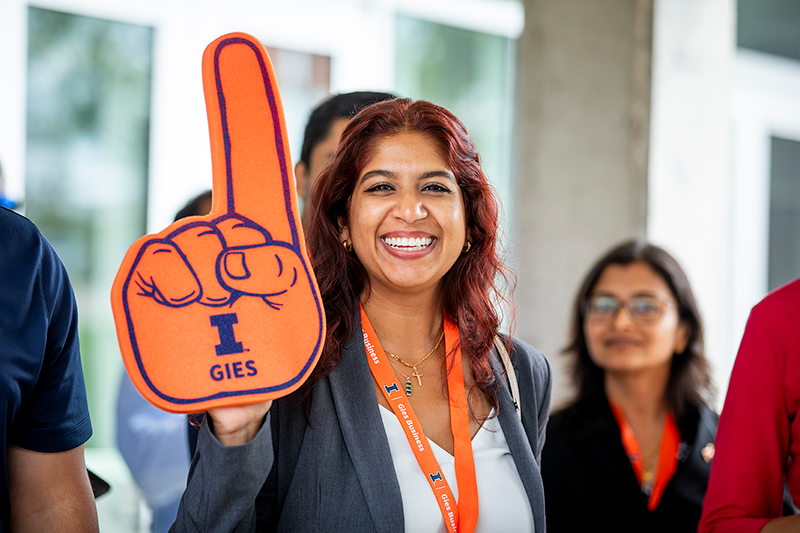 iConverge participant with orange foam finger